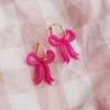 Wolf & Moon Mini Bow Hoops In Magenta 2 Wolf & Moon Mini Bow Hoops In Magenta -Wolf & Moon mini bow hoops magenta lifestyle 4